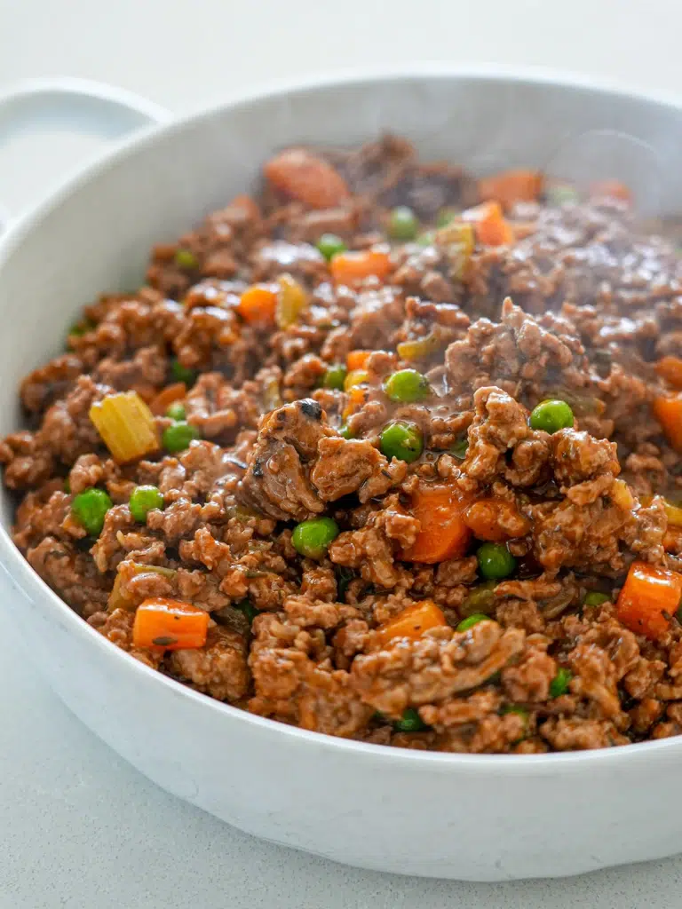 Homemade Shepherd's Pie filling ready for topping with potatoes.
