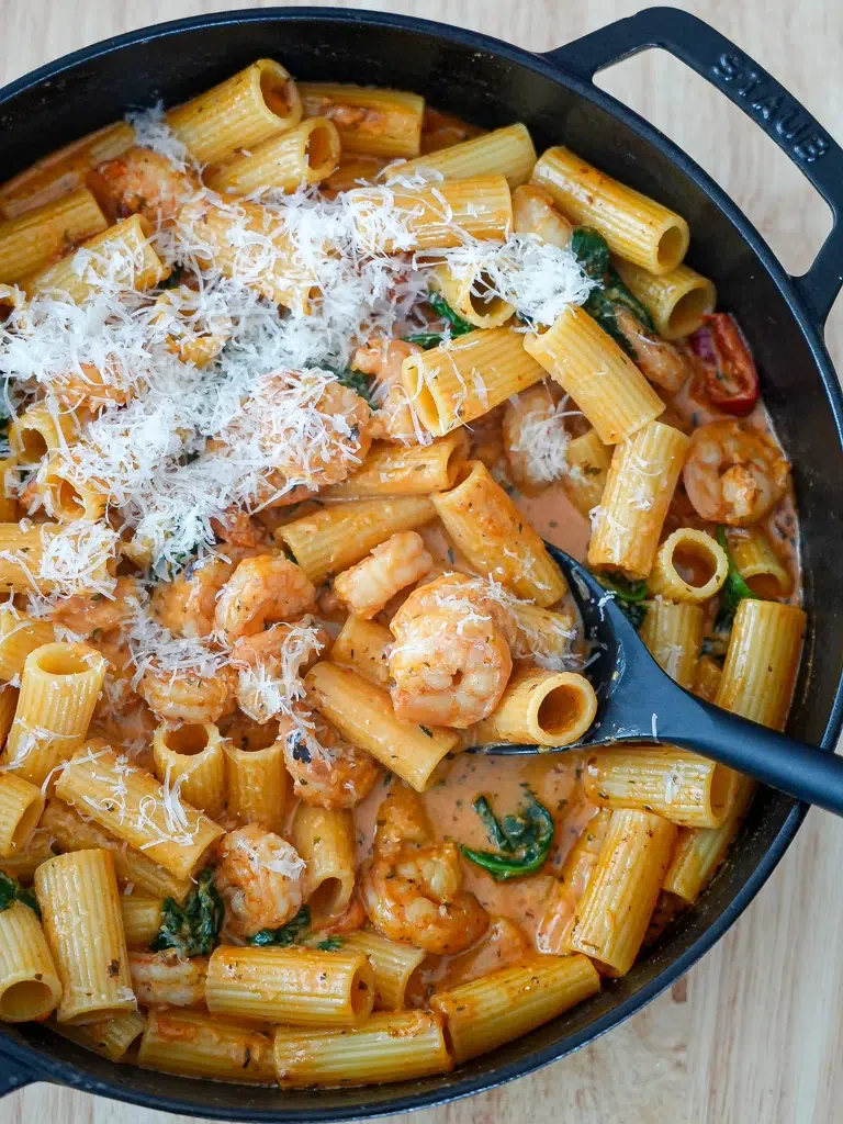 Close-up of Creamy Cajun Prawn Pasta in a pan, highlighting the creamy sauce and prawns