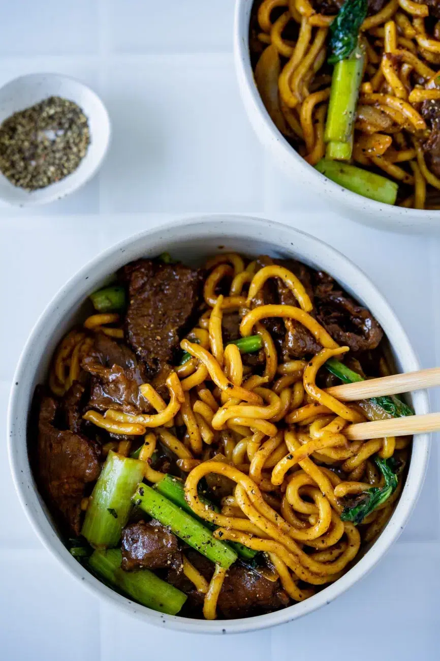 Bowl of Black Pepper Beef Noodles with chopsticks