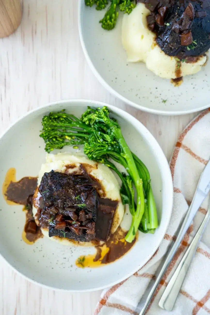 Two plates of Red Wine Braised Beef Short Ribs