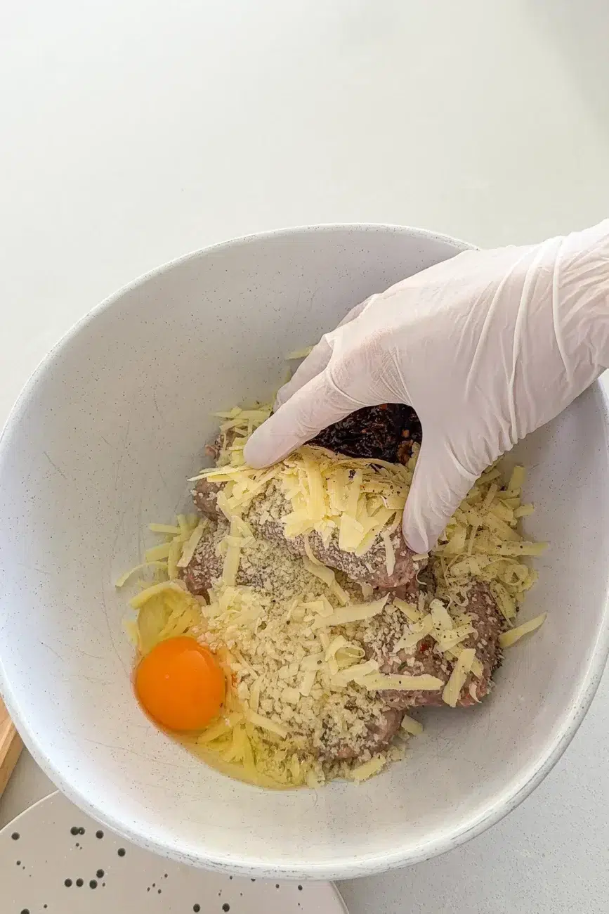 homemade sausage roll ingredients in bowl ready to be mixed