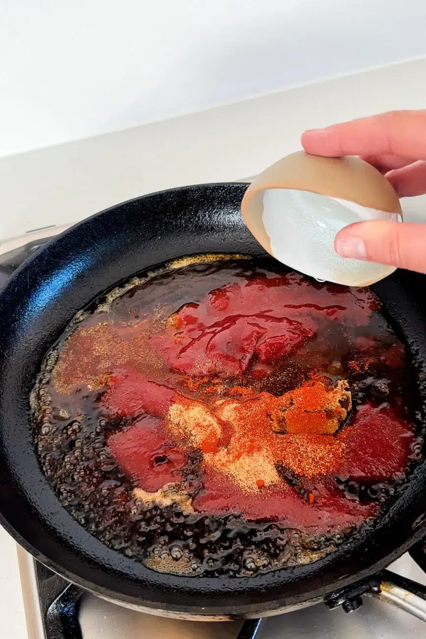 BBQ sauce ingredients being added to the pan