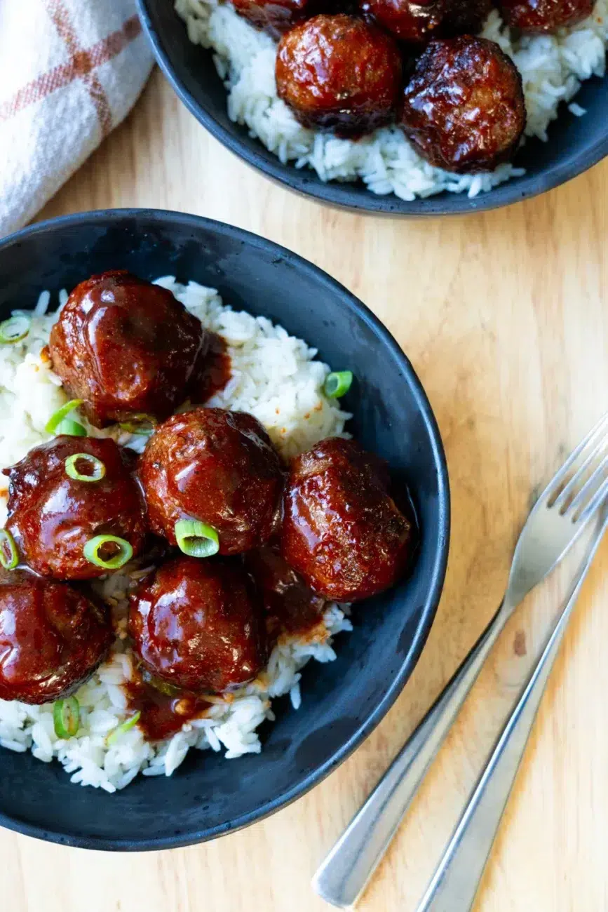 Finished meatballs two plates with rice