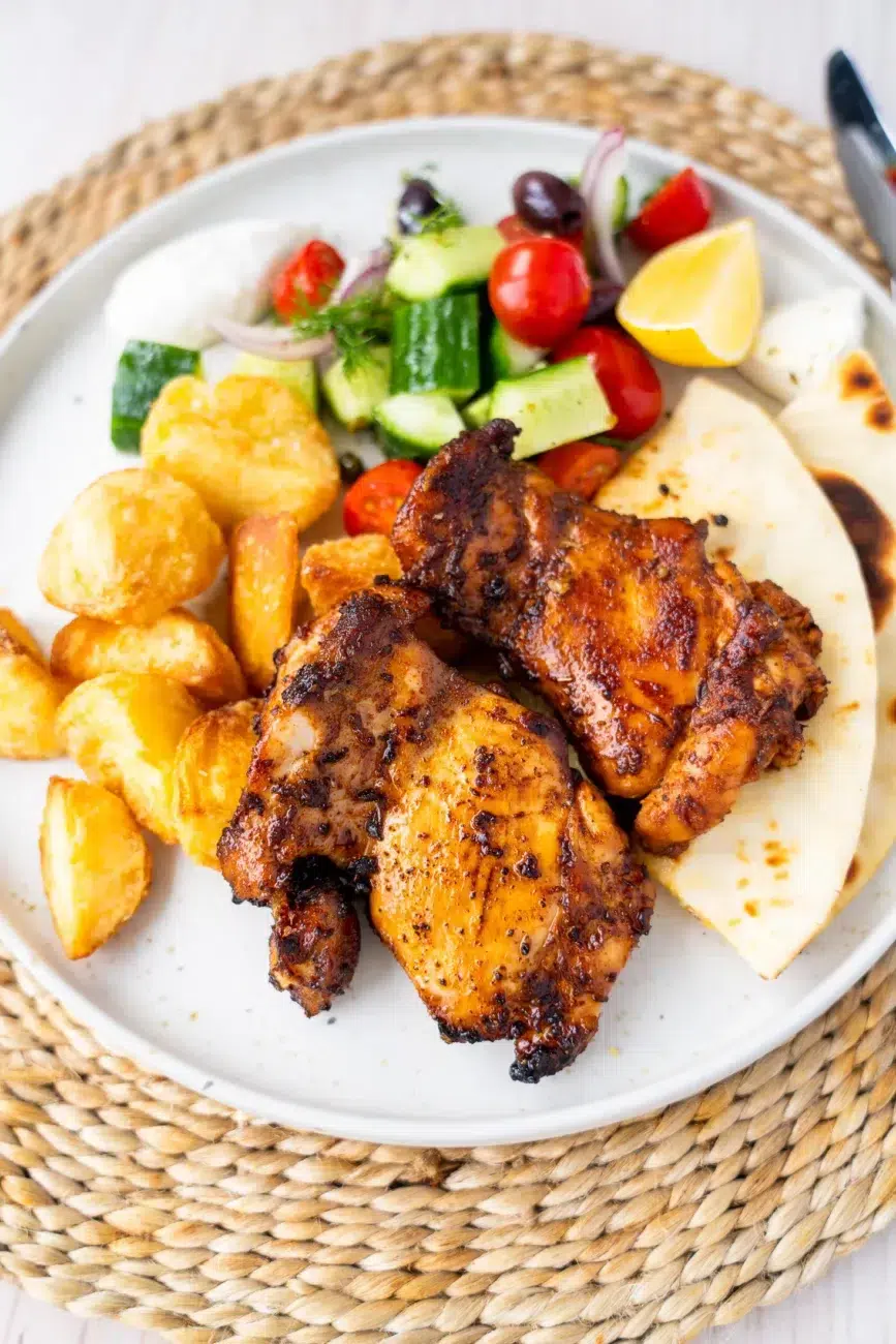 Village salad served with chicken and potatoes