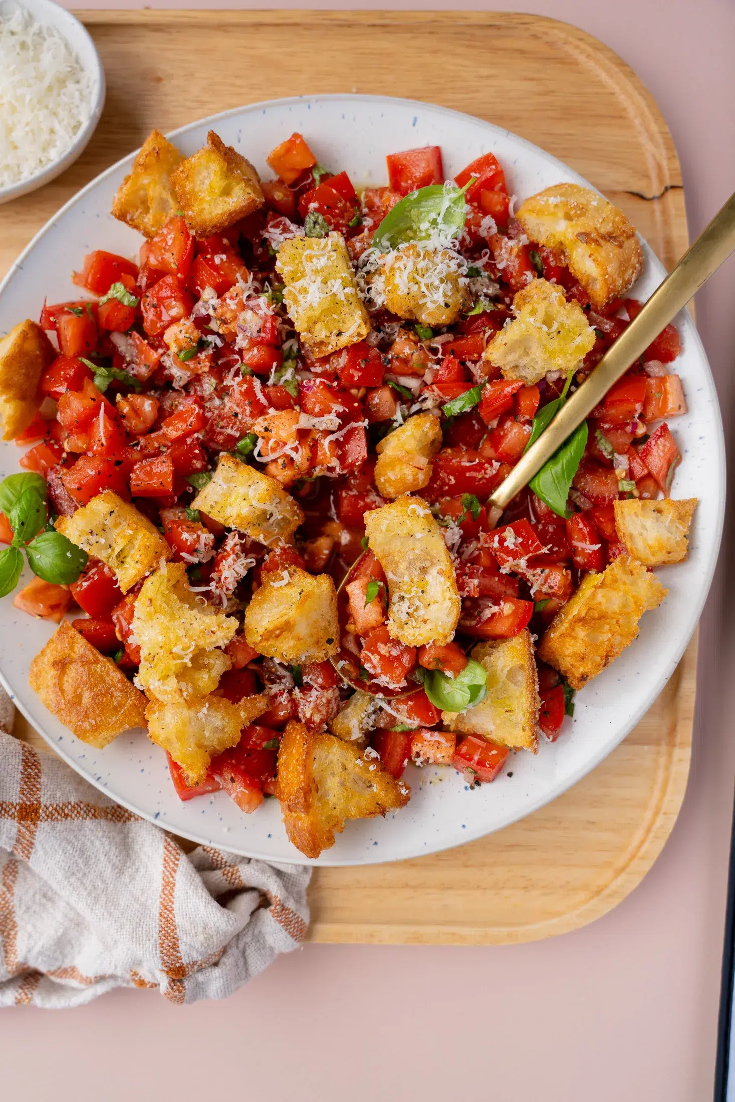 Close-up top view of bruschetta salad with garlic parmesan croutons