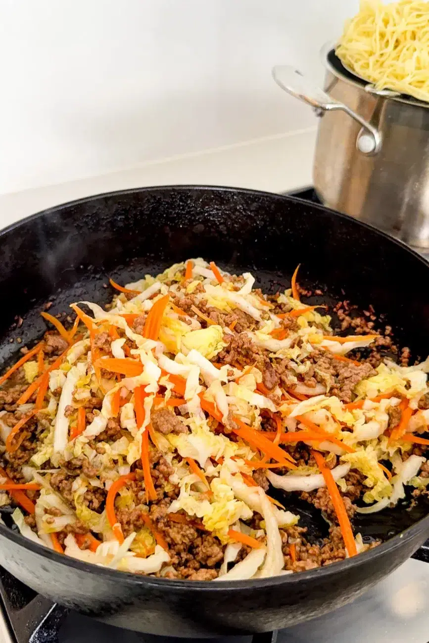 Beef carrot and cabbage tossed in pan