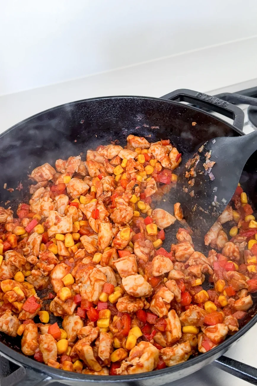 Capsicum and corn stirred through chicken with tomato paste and spices