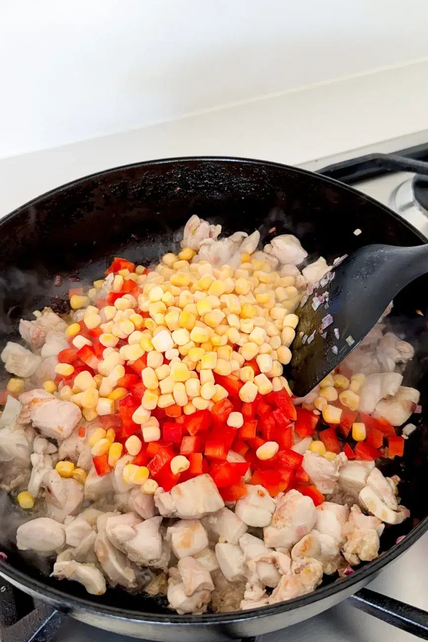 Chicken browned with capsicum and corn