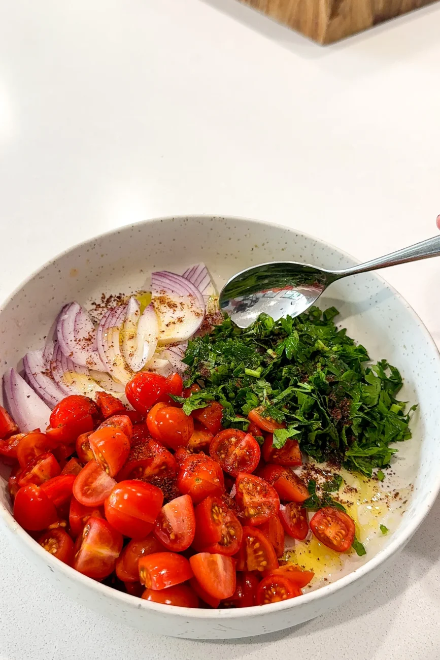 Fresh tomato and onion salad ready to be mixed