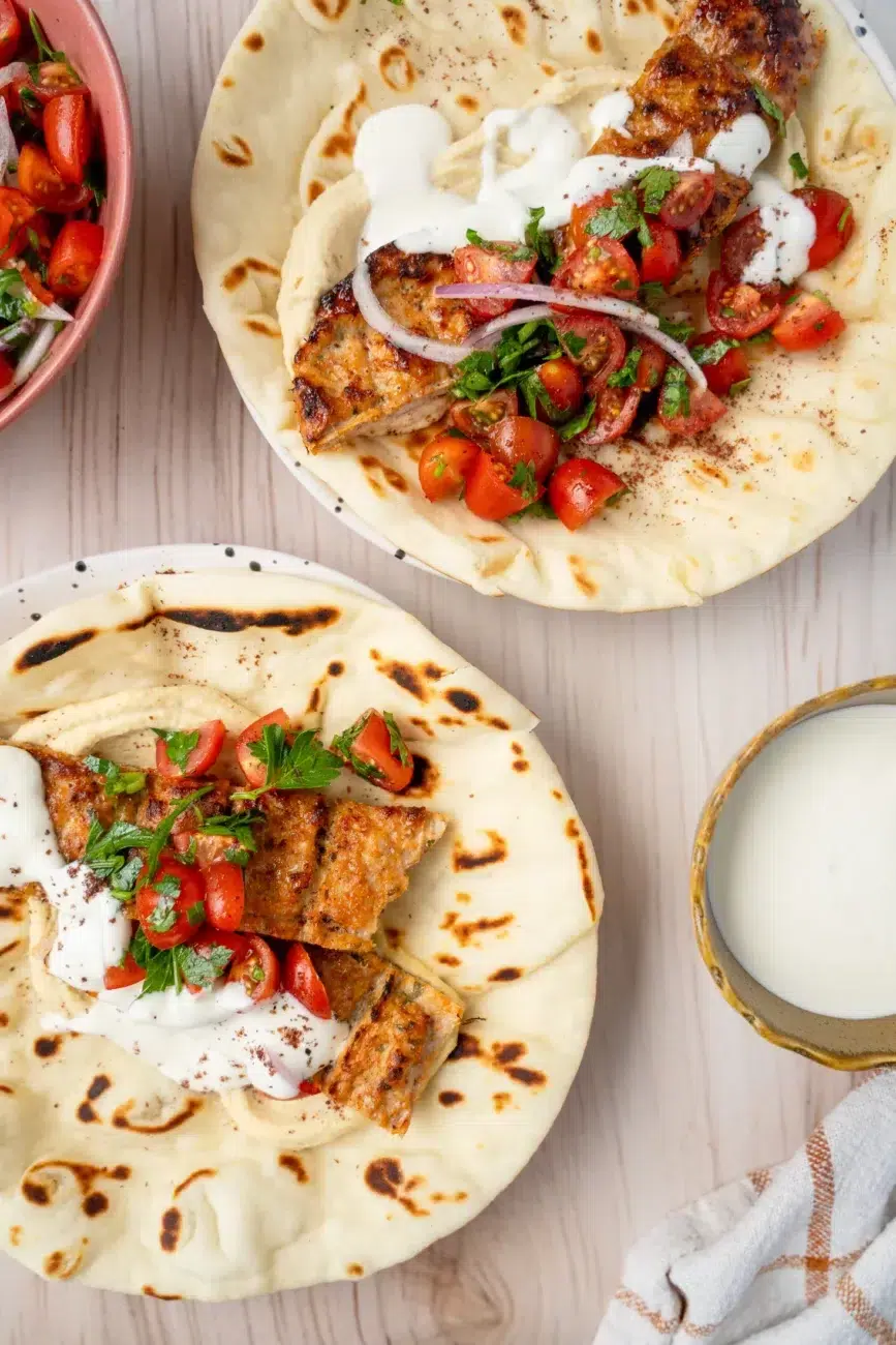 Two flatbreads with toppings top view