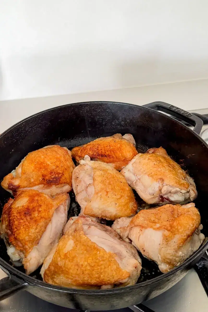 chicken in pot skin seared and golden brown