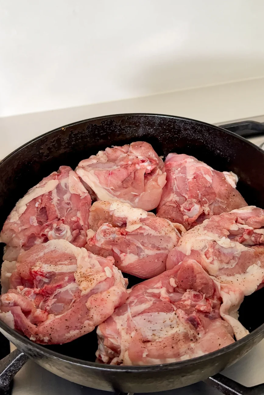 raw chicken in pot skin side down